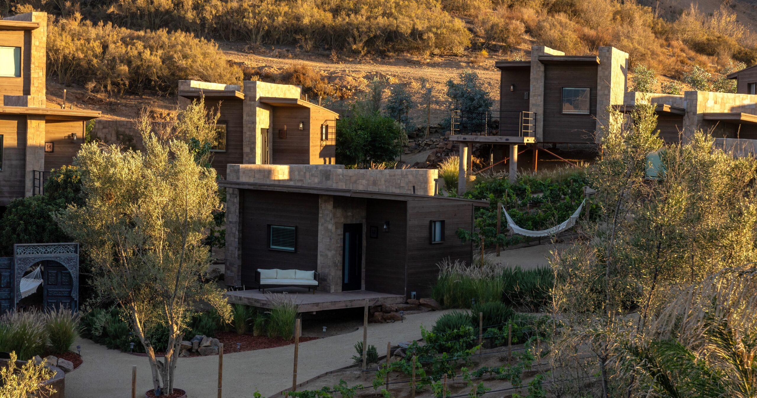Luxury cabins at O2 Resort Valle de Guadalupe offering peaceful accommodations surrounded by the scenic landscape of Baja California wine country