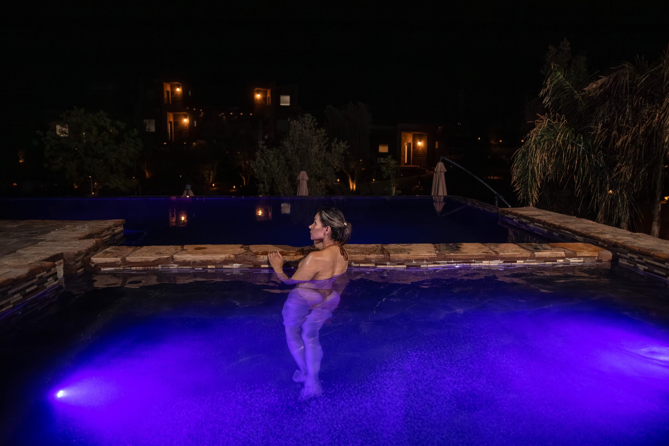 Woman relaxing by the pool at O2 Resort Valle de Guadalupe while enjoying the peaceful atmosphere of Baja California wine country