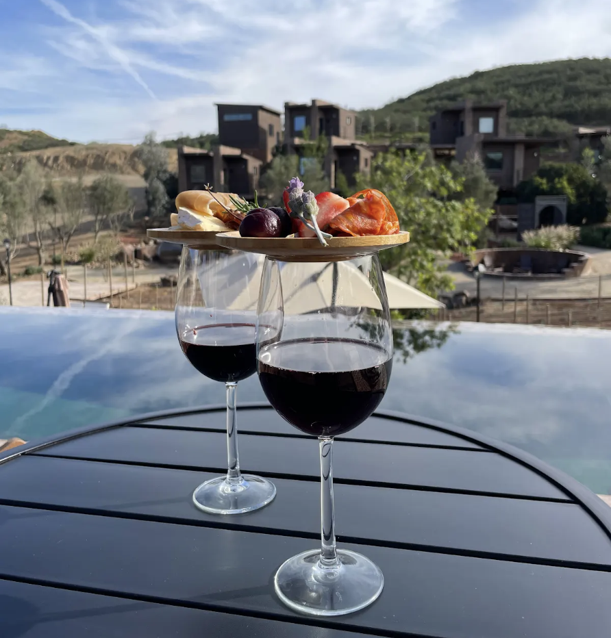 Two wine glasses at O2 Resort Valle de Guadalupe showcasing a refined wine country experience in Baja California