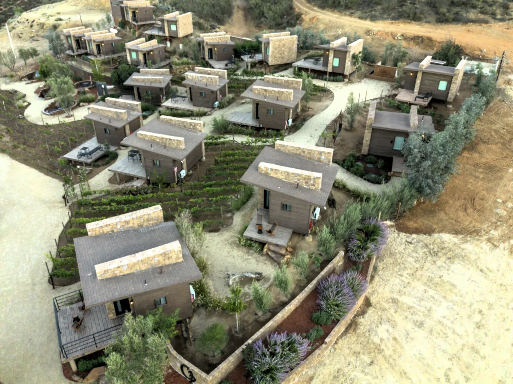 Aerial drone view of O2 Resort Valle de Guadalupe showcasing the resort and surrounding landscape of Baja California wine country