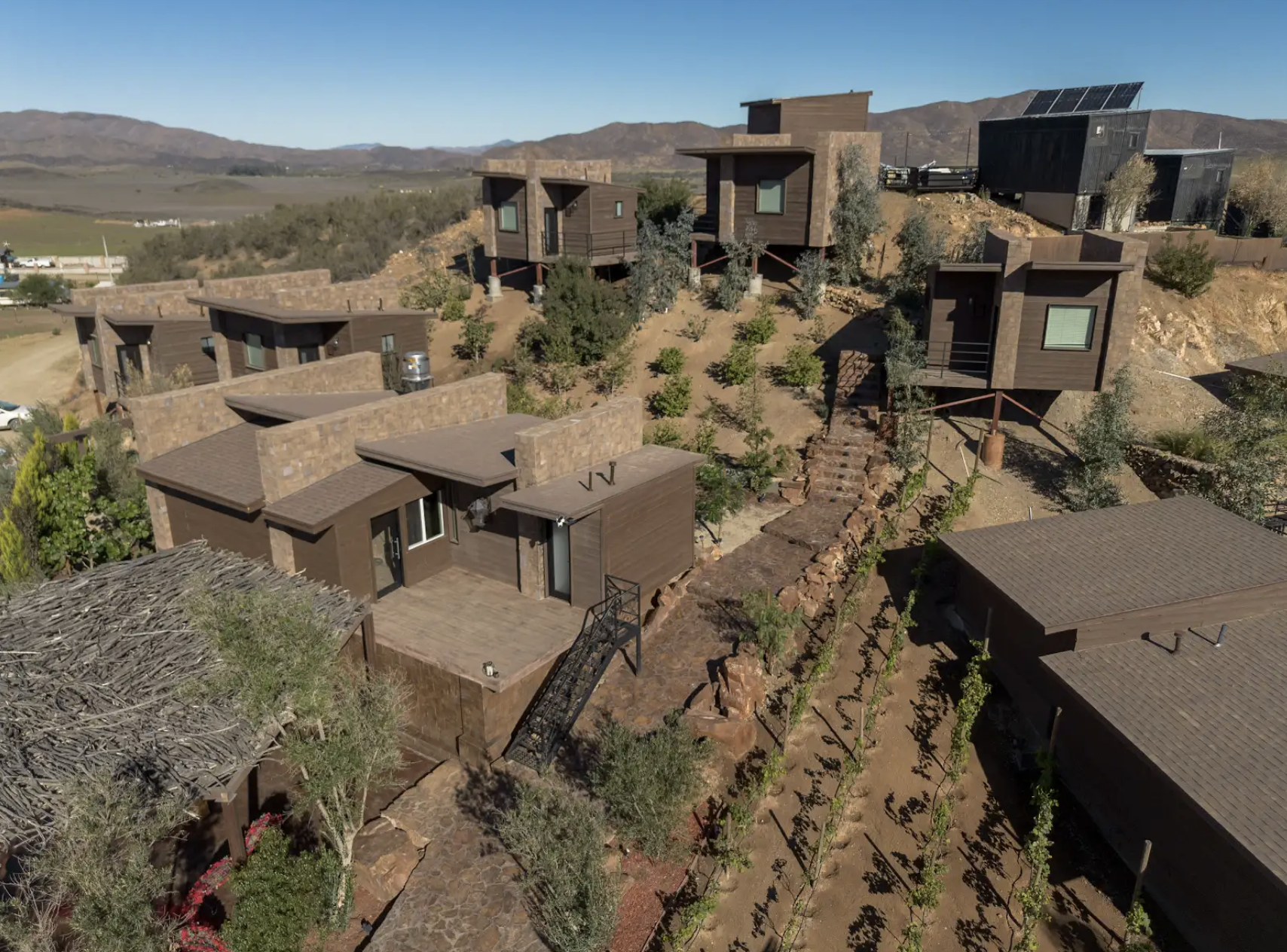 Aerial drone view of O2 Resort Valle de Guadalupe showcasing the resort and surrounding landscape of Baja California wine country