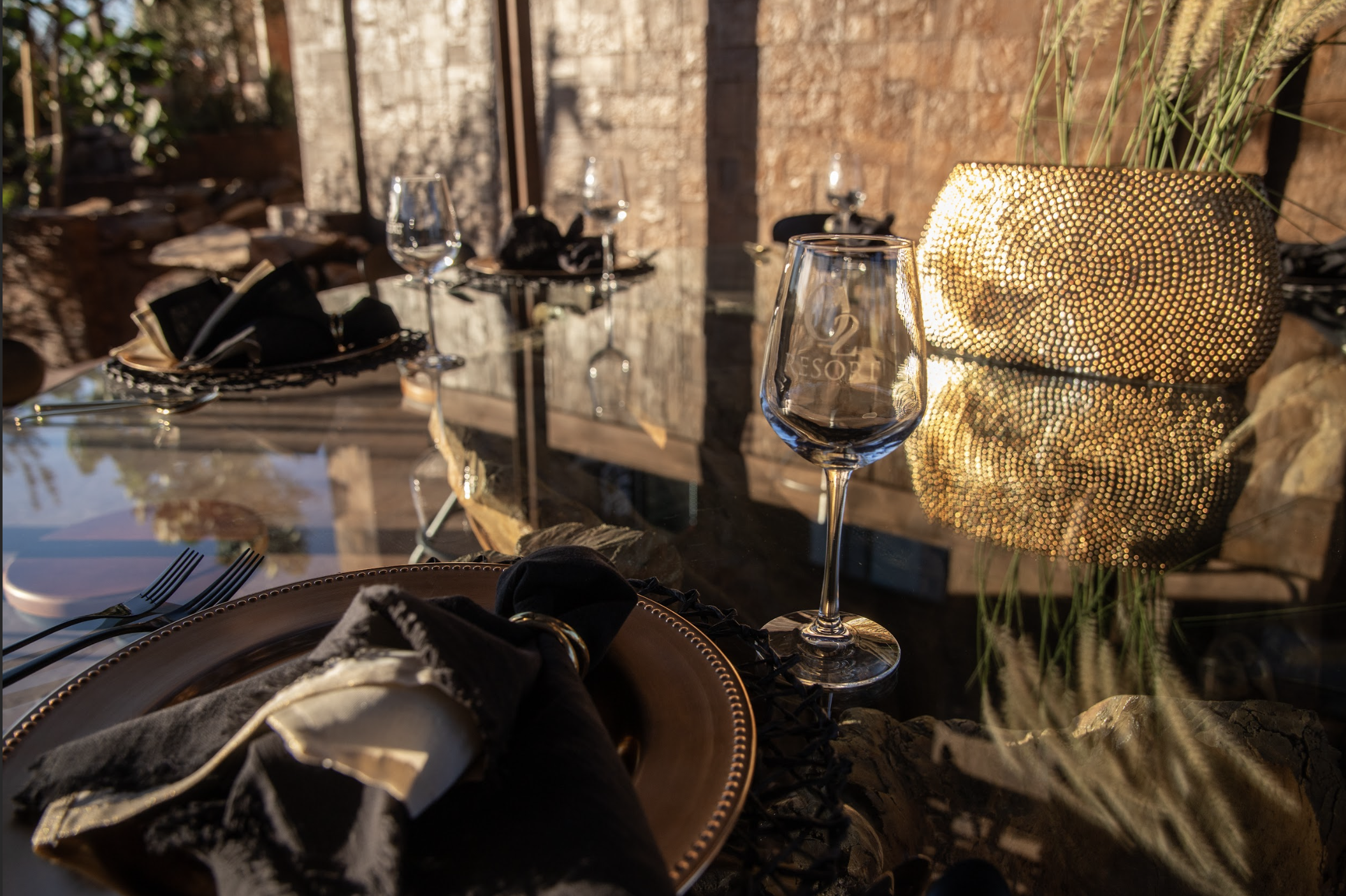 Wine glass at O2 Resort Valle de Guadalupe highlighting the relaxing wine country experience of Baja California