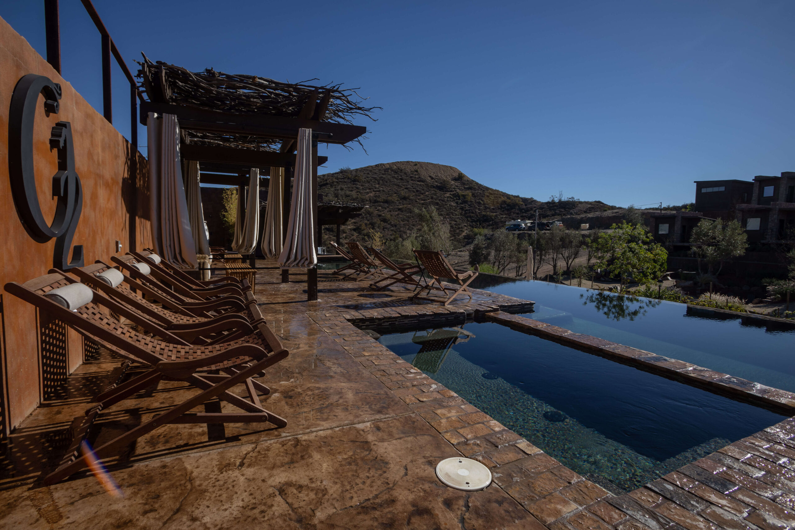 Luxury outdoor jacuzzi at O2 Resort Valle de Guadalupe offering a relaxing spa experience with panoramic vineyard views in Baja California wine country
